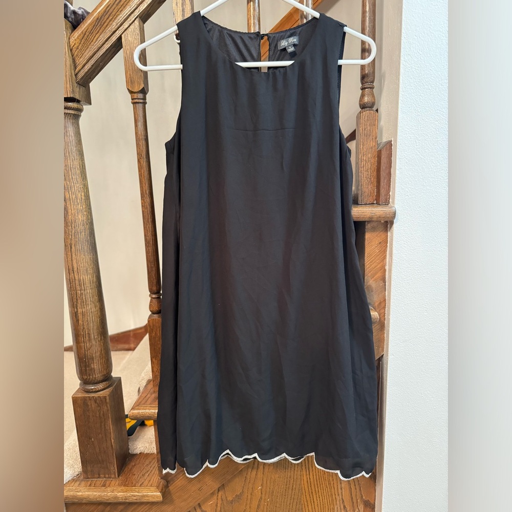 Black Lily Rose dress with white detailed trim
